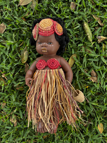 Doll with handwoven raffia accessories